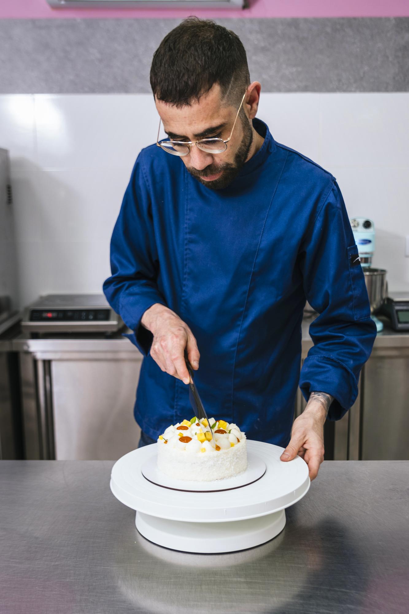 Founder arranging plated meal in studio kitchen