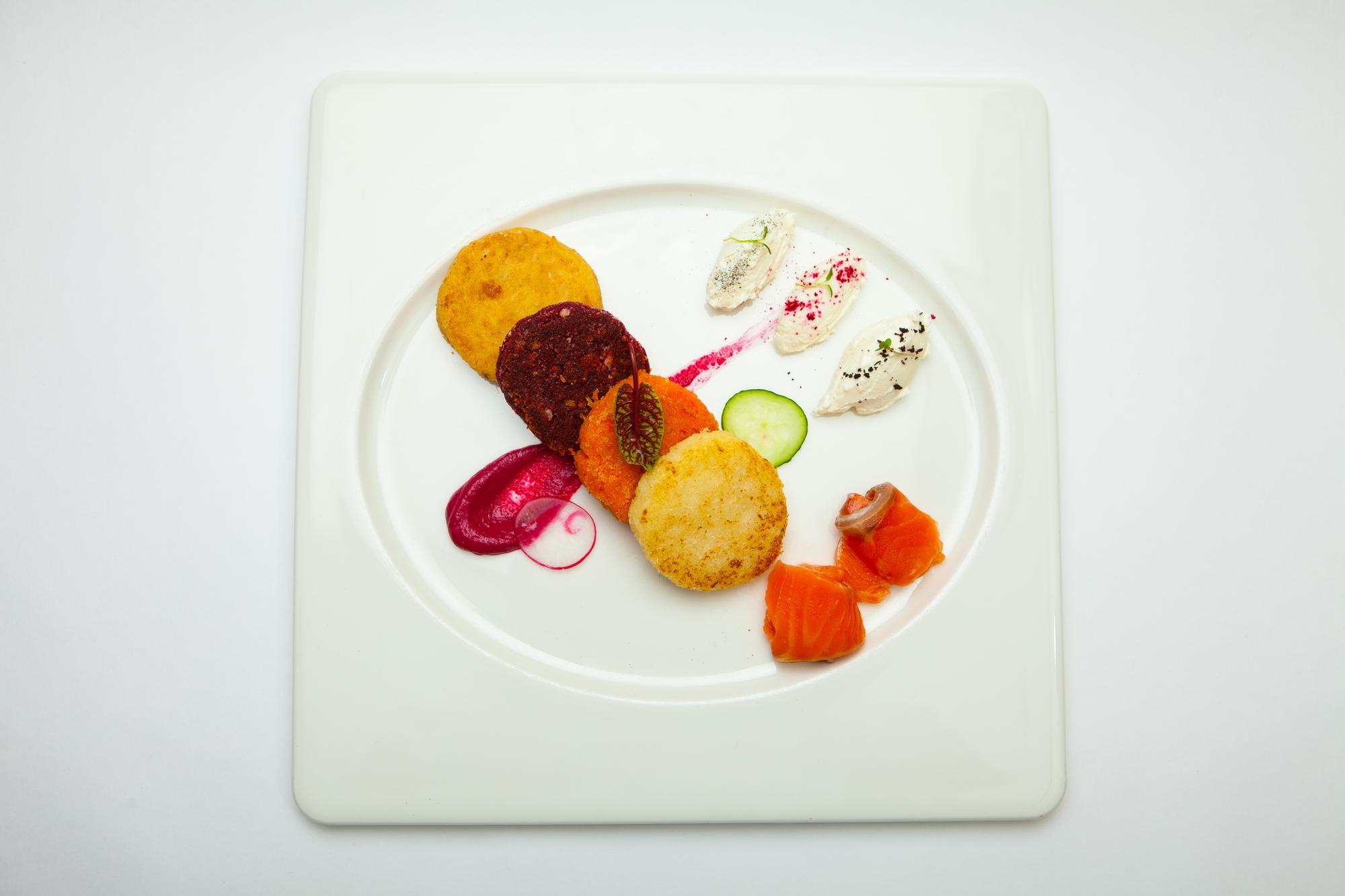 Asymmetric shot: flatlay of three plated meals